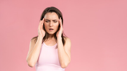 Have a migraine or severe headache while massaging the temporal lobe of the head young woman...