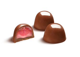 Two delicious chocolate bonbons with half showing starwberry filling, isolated