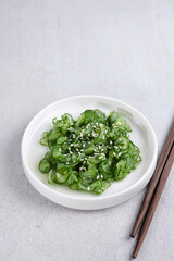 Obraz na płótnie Canvas Salad Timun Jepang. Japanese cucumber salad with sesame seed or sunomono.