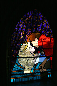 Stained glass window with the prince's kiss to Sleeping Beauty. Disney movie. Sleeping Beauty Story. Princess Castle at Euro Disney. Disney Land Paris. The magic of Disney. Aurora.