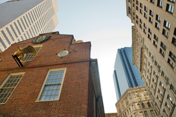 in boston downtown,  one historic building surrounded by different modern buildings