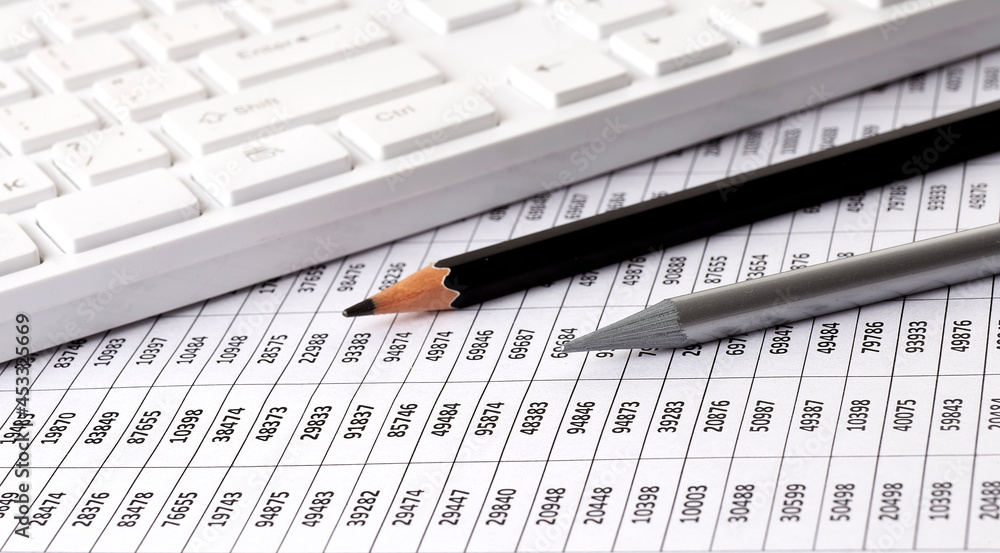 Poster business charts report with keyboard on desk of financial advisor. financial concepts.