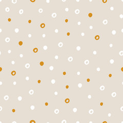 Vector abstract cute hand drawn seamless pattern with a irregular dots on a beige background. Pastel baby texture ideal for fabric, wallpaper, wrapping paper, card, layout. Delicate children's print.