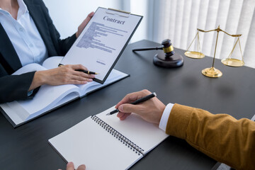  Judge gavel with Justice lawyers having team meeting at law firm background. Concepts of Law and Legal services.