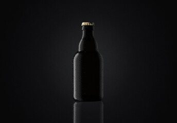 33cl fresh Steinie beer bottle with water drops on black background, backlit, suitable for...