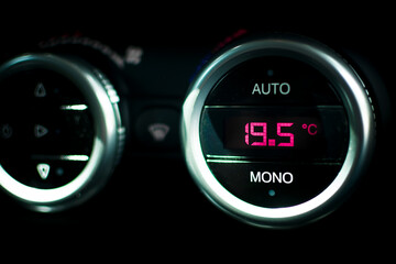 an automatic air conditioning system in a vehicle indicates a temperature of 19.5 ° C