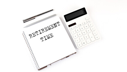 Notepad with text RETIREMENT PLAN with calculator and pen. White background. Business concept