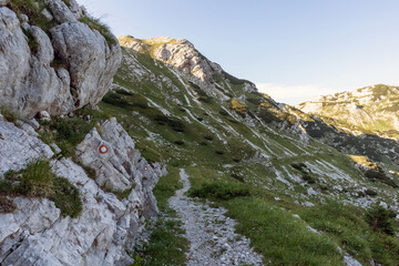 Fototapeta na wymiar Marked hiking path in the mountains in European Alps