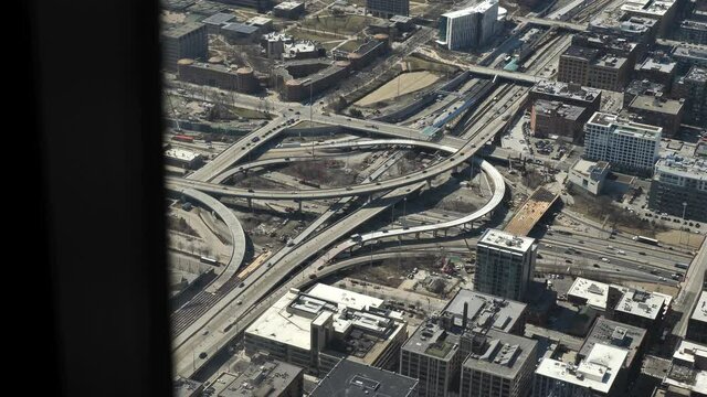 Chicago USA Busy Urban Traffic View From Skyscraper Window. Cars on Freeways and Overpass on Sunny Day, Slow Motion