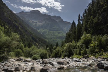 Clouds passing over monte pedido mountains and river