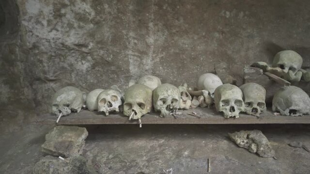 Tampang Allo, Tana Toraja, Indonesia - Tau Tau Human Skulls Piles of Bones Burial Graves Cave
