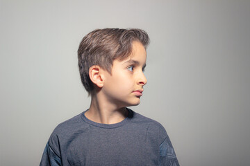 child boy looking to the side confident