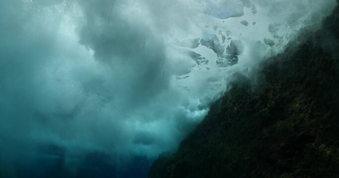 choppy water wavy sea underwater wave hit on rocks and makes foam on the surface of the sea ocean scenery 