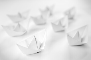 White paper boats or Origami boats on white background.
