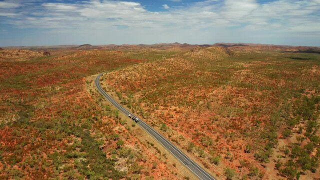 Aerial View Of Truck Transporting Goods At State Highway In Northern Territory, Australian Outback.