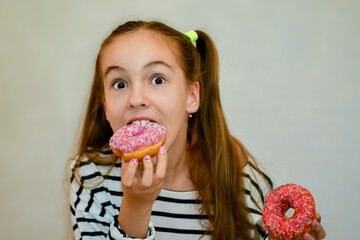 Happy smiling young girl with donuts Delicious bright food