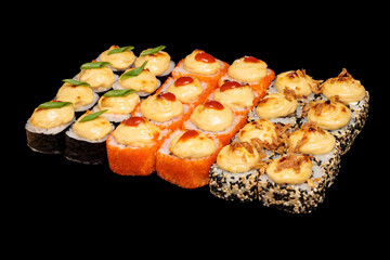 Japanese food: maki and nigiri sushi set on black background. side view composition.