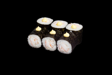 Japanese food: maki and nigiri sushi set on black background. side view composition.