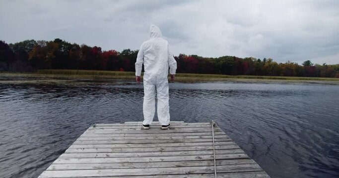 Fourth Wave Delta Variant: lockdown hazardous material suit during the fall season as virus rages causing fear and anxiety