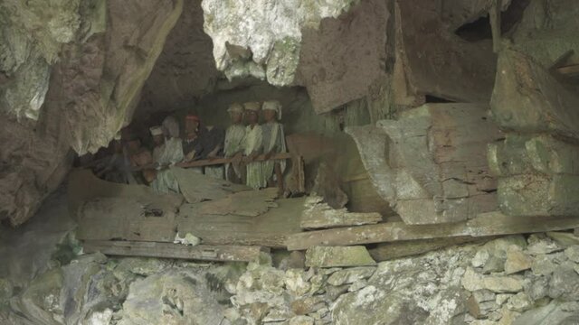 Tampang Allo, Tana Toraja, Indonesia - Tau Tau Human Skulls Piles of Bones Burial Graves Cave