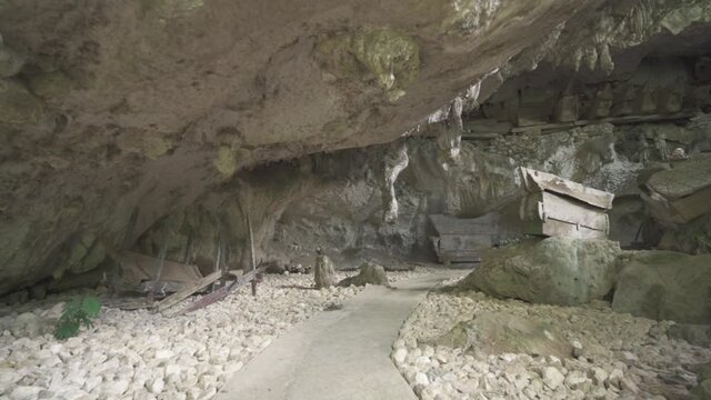 Tampang Allo, Tana Toraja, Indonesia - Tau Tau Human Skulls Piles of Bones Burial Graves Cave