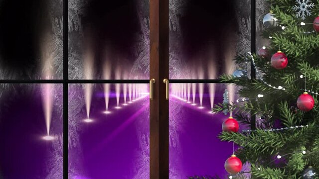 Christmas tree and wooden window frame against spot lights on purple background