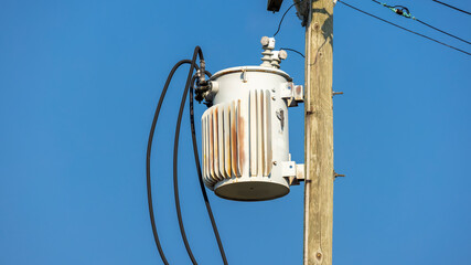 Close up shot of Power transformer on the electrical pole
