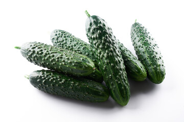 Set of fresh whole cucumbers isolated on a white background, clipping path. Garden cucumber wallpaper backdrop design