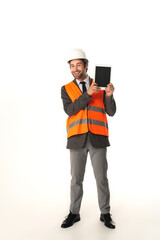 Full length of smiling engineer with digital tablet looking at camera on white background