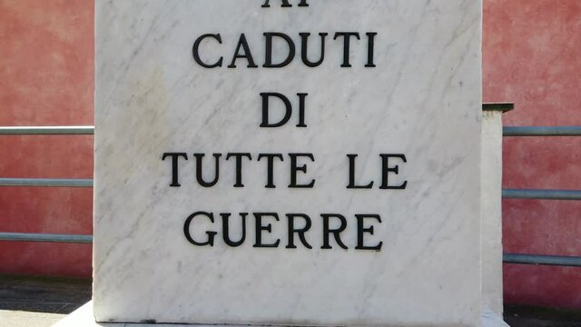 Europe, Italy august 2021 Marble plaque with inscription in memory of all the fallen of the wars, in memory of the soldiers and partisans who died in the World Wars