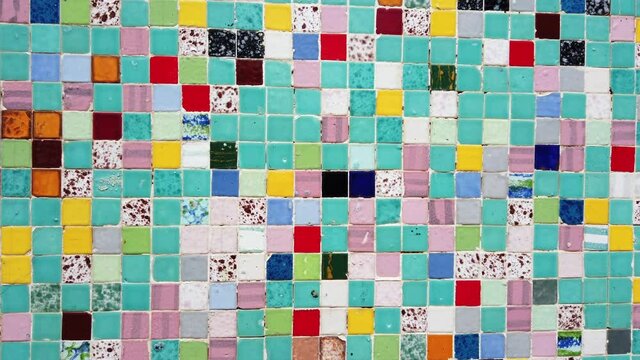 patchwork of colors made with small tiles of various colors ( Bisazza )on the facade of a house