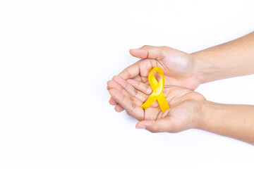 two hands holding yellow ribbon, childhood cancer, white background