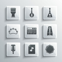 Set Music book with note, Dial knob level, Metronome pendulum, synthesizer, Microphone, Tambourine, Drum and Balalaika icon. Vector
