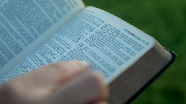 close-up young woman reading bible at christian teachings in christianity