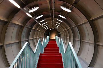 red stairs down the tunnel