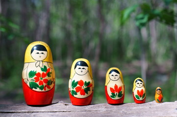 Figures of matryoshka dolls in close-up. The dolls are standing in a row.