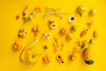 Yellow vegetables on the yellow background