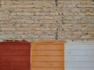 Three colors to choose on an old brick wall