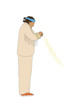 Indigenous man praying with corn pollen