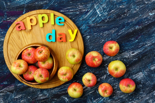Apple is a national holiday on October 21. Red apples on a dark background. Top view