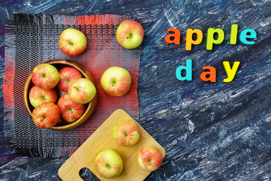 Apple is a national holiday on October 21. Red apples on a dark background. Top view