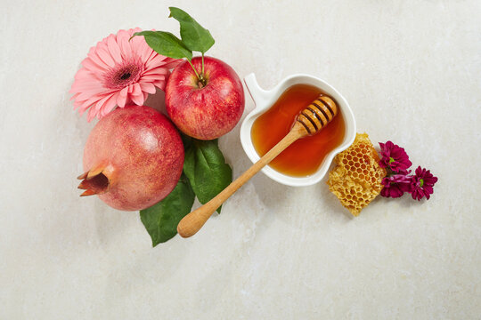 Rosh hashanah, jewish New Year holiday. Concept of traditional or religion symbols on travertine stone background