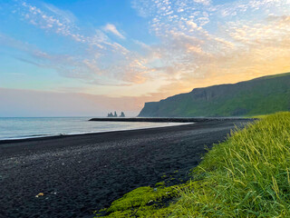 Black sand beach in the midnight sun, South Iceland
