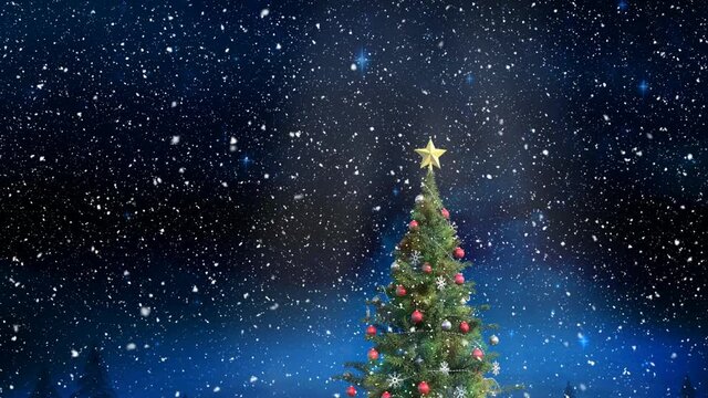 Snow falling over christmas tree against shining blue stars in the night sky