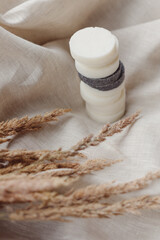 Fototapeta na wymiar Stack of assorted natural soap bars with lavender on linen textile cloth. Pastel colors
