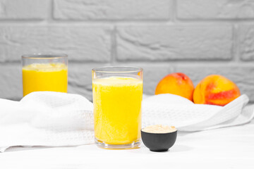 Peach and Maca Smoothie on white brick background, horizontal resolution, Copy Space, Juicy Trendy Food