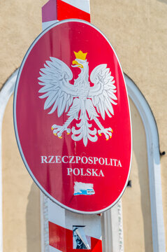 Cieszyn, Poland - June 5, 2021: Coat of arms of Poland, white, crowned eagle with a golden beak and talons, on a red background.