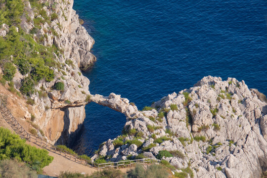 Arco azzurro rocky arch by the sea in Sicily