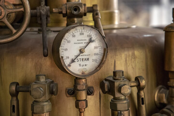 Closeup of a pressure gauge for a steam mach