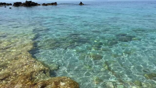Crystal clear water of Ionian Sea in Albania, Dhermi village beach. Popular tourism destination. High quality 4k footage